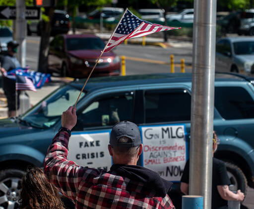 April 24, 2020, Albuquerque, New Mexico, USA: April 24, 2020 Protestors gather near Civic Plaza in downtown Albuquerque to demand government officials to re-open businesses deemed nonessential. As demonstrators held signs, outside City Hall, protestors honked, waved banners and American flags. Albuquerque USA - ZUMAab1_ 20200424_zaf_ab1_003 Copyright: xAnthonyxJacksonx