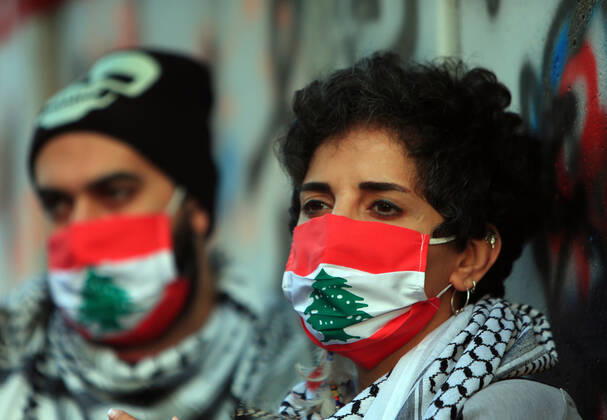 April 23, 2020, Beirut, Beirut, Lebanon: Lebanese protesters Anti-government, some wearing masks to help curb the spread of the coronavirus, shout slogans as they march during a protest against the Lebanese central bank s governor Riad Salameh and against the deepening financial crisis, at Hamra trade street, in Beirut, Lebanon, April 23, 2020. Lebanon s currency continued its downward spiral against the dollar on Thursday, reaching a new low amid financial turmoil in the crisis-hit country compounded by the coronavirus outbreak Beirut Lebanon - ZUMAap3_ 20200423_zaf_ap3_177 Copyright: xHaithamxAl-Mousawix