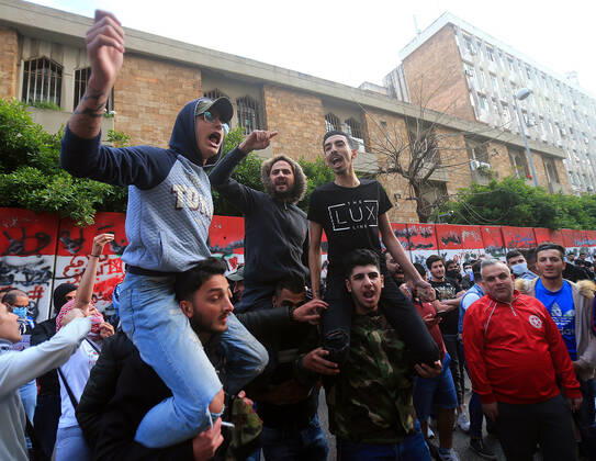 April 23, 2020, Beirut, Beirut, Lebanon: Lebanese protesters Anti-government, some wearing masks to help curb the spread of the coronavirus, shout slogans as they march during a protest against the Lebanese central bank s governor Riad Salameh and against the deepening financial crisis, at Hamra trade street, in Beirut, Lebanon, April 23, 2020. Lebanon s currency continued its downward spiral against the dollar on Thursday, reaching a new low amid financial turmoil in the crisis-hit country compounded by the coronavirus outbreak Beirut Lebanon - ZUMAap3_ 20200423_zaf_ap3_178 Copyright: xHaithamxAl-Mousawix