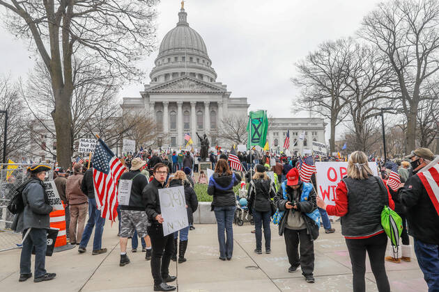 MADISON, WI - APRIL 24: At a Rally to Reopen Wisconsin , Safer at Home protesters demonstrate against measures enacted to mitigate the Coronavirus congregate close together to hear speeches on April 24, 2020 at the Wisconsin state Capitol in Madison, WI. (Photo by Lawrence Iles Icon Sportswire)