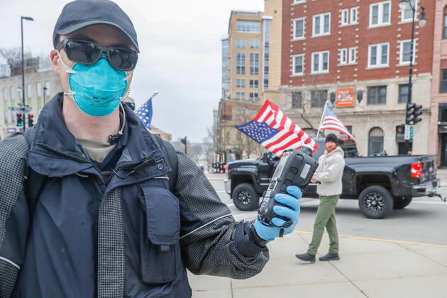 April 24, 2020, Madison, WI, USA: MADISON, WI - APRIL 24: At a Rally to Reopen Wisconsin , Safer at Home air quality was monitored on April 24, 2020 at the Wisconsin state Capitol in Madison, WI. ( Icon Sportswire) Madison USA - ZUMAi88_ 20200424_zaf_i88_010 Copyright: xLawrencexIlesx