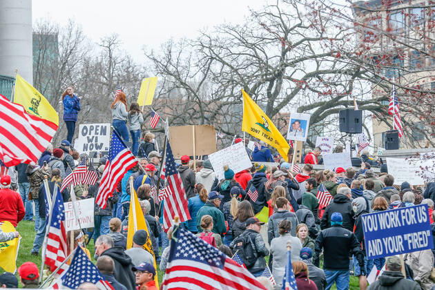 April 24, 2020, Madison, WI, USA: MADISON, WI - April 24: At a Rally to Reopen Wisconsin , Safer at Home protesters demonstrate against measures enacted to mitigate the corona virus on April 24, 2020 at the Wisconsin state Capitol in Madison, WI. ( Icon Sportswire) Madison USA - ZUMAi88_ 20200424_zaf_i88_017 Copyright: xLawrencexIlesx