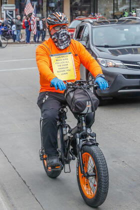 April 24, 2020, Madison, WI, USA: MADISON, WI - April 24: A counter protester mocks Safer at Home protesters demonstrating against measures enacted to mitigate the corona virus on April 24, 2020 at the Wisconsin state Capitol in Madison, WI. ( Icon Sportswire) Madison USA - ZUMAi88_ 20200424_zaf_i88_027 Copyright: xLawrencexIlesx