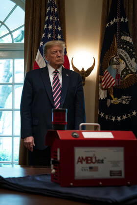 April 24, 2020, Washington, District of Columbia, USA: United States President Donald J. Trump looks at AMBUstat, a decontaminator device during a presentation from NASA leadership on their COVID-19 response in the Cabinet Room of the White House in Washington DC on April 24th, 2020 Washington USA - ZUMAs152 20200424_zaa_s152_066 Copyright: xAnnaxMoneymakerx