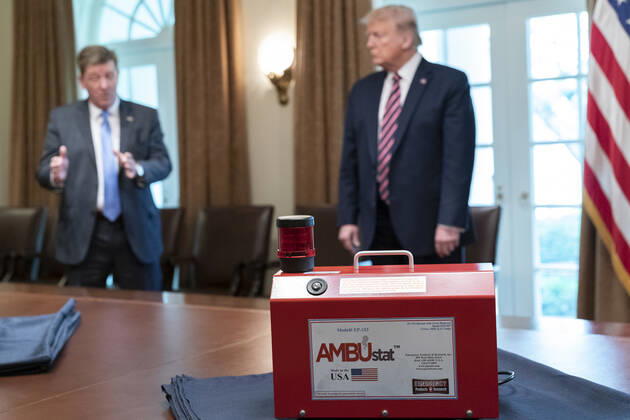 April 24, 2020, Washington, The District of Columbia, United States Of America: President Donald J. Trump listens as Dave Gallagher, Associate Director of the NASA Jet Propulsion Laboratory, explains the development of devices like the AMBUstat as part of NASAs response to the coronavirus pandemic Friday, April 24, 2020, in the Cabinet Room of the White House...People: President Donald Trump. Washington United States Of America - ZUMAs214 20200424_zaa_s214_004 Copyright: xSMGx