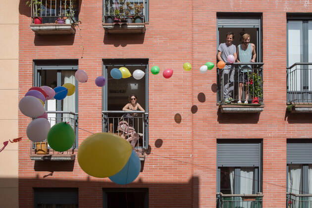 April 24, 2020, Madrid, Spain: People stand at their balconies along a decorated street with balloons during the covid 19 crisis..Day 41 of the state of alarm due to the Coronavirus health crisis. Spain has had more than 200,000 confirmed cases of COVID-19 and over 20,000 reported deaths. Daily deaths from coronavirus have dropped in the last 24 hours to 367, the lowest rate in a month. Madrid Spain - ZUMAs197 20200424_zaa_s197_216 Copyright: xGuillermoxGutierrezx