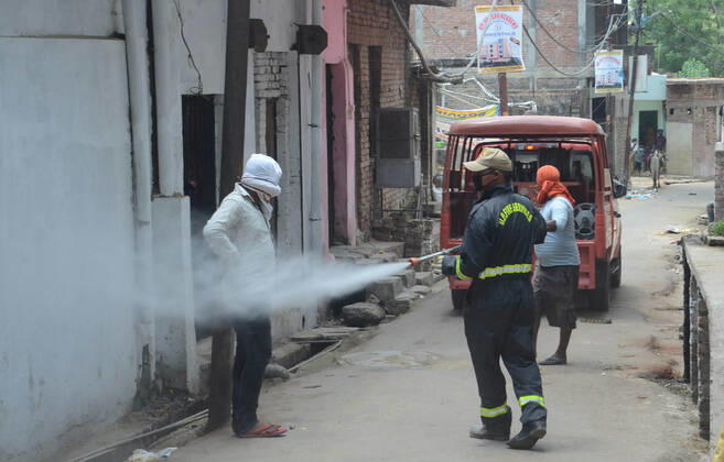 April 25, 2020, Prayagraj, Uttar Pradesh, India: Prayagraj: Police sanitise hotspot area Telierganj during a government-imposed nationwide lockdown as a preventive measure against the COVID-19 coronavirus, in Allahabad on April 24, 2020. Prayagraj India - ZUMAv115 20200425_zap_v115_005 Copyright: xPrabhatxKumarxVermax
