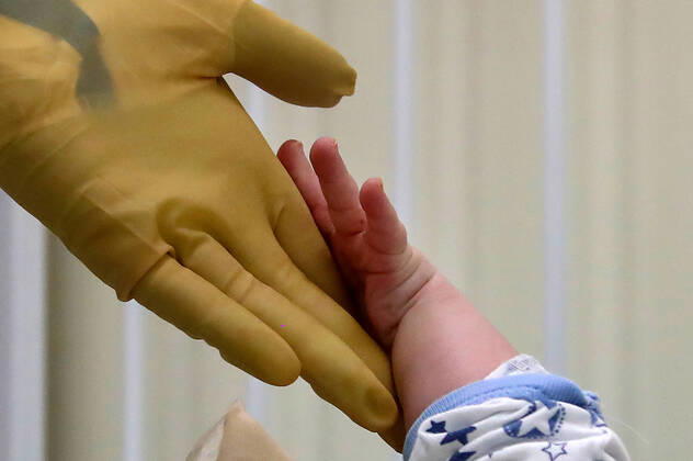MOSCOW, RUSSIA - APRIL 24, 2020: A medical staff member and a young patient in the centre for infectious diseases, which opened on 20 April 2020 at the National Medical Research Centre for Children s Health (NMITS) to treat young patients with suspected or confirmed novel coronavirus infection (COVID-19). The medical facility has 300 beds, an additional 30 beds in the intensive care unit, and 8 operating rooms. Valery Sharifulin TASS  TS0D7036