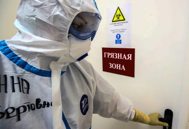 MOSCOW, RUSSIA - APRIL 24, 2020: A medical staff member in protective gear enters the red zone in the centre for infectious diseases, which opened on 20 April 2020 at the National Medical Research Centre for Children s Health (NMITS) to treat young patients with suspected or confirmed novel coronavirus infection (COVID-19). The medical facility has 300 beds, an additional 30 beds in the intensive care unit, and 8 operating rooms. Valery Sharifulin TASS  TS0D7043