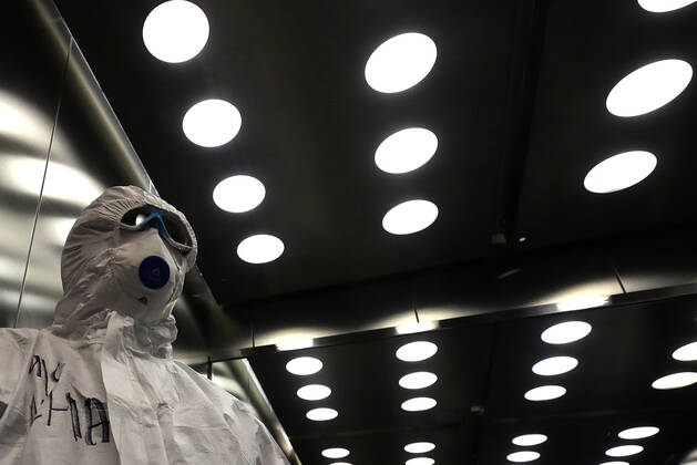 MOSCOW, RUSSIA - APRIL 24, 2020: A medical staff member in protective gear in a lift in the centre for infectious diseases, which opened on 20 April 2020 at the National Medical Research Centre for Children s Health (NMITS) to treat young patients with suspected or confirmed novel coronavirus infection (COVID-19). The medical facility has 300 beds, an additional 30 beds in the intensive care unit, and 8 operating rooms. Valery Sharifulin TASS  TS0D704C