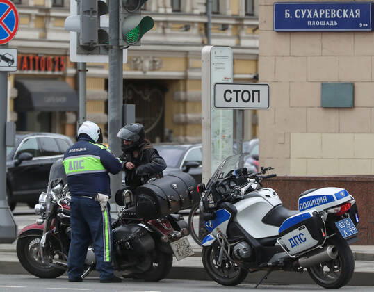 MOSCOW, RUSSIA - APRIL 25, 2020: A traffic police officer carries out an ID check during the pandemic of the novel coronavirus disease (COVID-19). Since 30 March, Moscow has been on lockdown. Traffic police have set up checkpoints around the city to stop vehicles and see if drivers have permission to travel during the lockdown. On 13 April 2020, the Moscow government introduced a digital permit system aimed at further restricting movement. Under the scheme, which became mandatory on 15 April, people need to apply for permits to travel on a vehicle or public transport around the city. As of 25 April 2020, Russia has reported more than 68,700 confirmed cases of the novel coronavirus infection, with more than 36,800 confirmed cases in Moscow. Vladimir Gerdo TASS TS0D705E