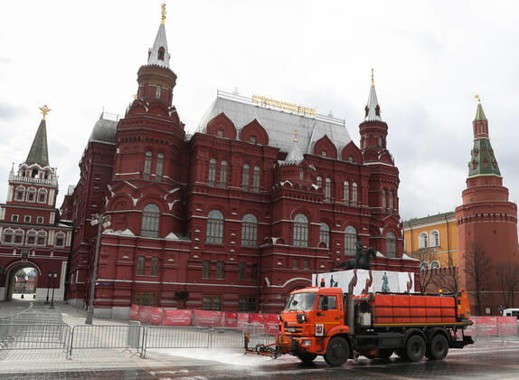 MOSCOW, RUSSIA - APRIL 25, 2020: A street cleaner sprays disinfectant in Manezhnaya Square in central Moscow during the pandemic of the novel coronavirus disease (COVID-19). Since 30 March, Moscow has been on lockdown. Earlier, the Russian government announced a paid period off work for employed people, which has been extended till the end of April. As of 25 April 2020, Russia has reported more than 68,700 confirmed cases of the novel coronavirus infection, with more than 36,800 confirmed cases in Moscow. Vladimir Gerdo TASS  TS0D7063