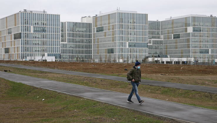 MOSCOW, RUSSIA â€“ APRIL 25, 2020: A man in a face mask walks near the Novomoskovsky multipurpose medical centre for patients with suspected COVID-19 coronavirus infection, in Kommunarka, Novomoskovsky Administrative District of Moscow. As of 25 April 2020, Russia has reported more than 68,700 confirmed cases of the novel coronavirus, with more than 36,800 confirmed cases in Moscow. Gavriil Grigorov TASS  TS0D7073