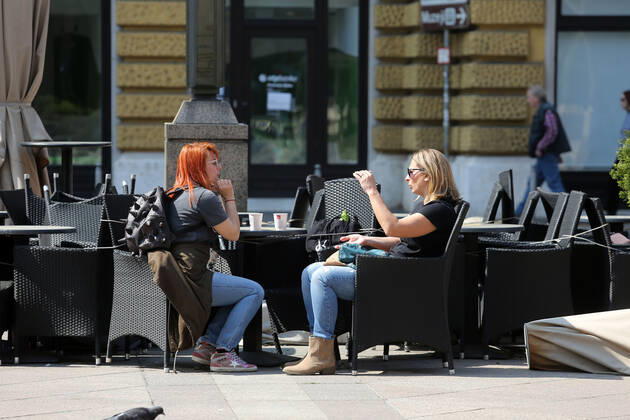 As traders prepare window displays to open, citizens stroll through Korzo 25.04.2020., Croatia, Rijeka - Numerous citizens walked through Korzo. Shops are setting up shop windows ahead of opening next week. GoranxKovacic PIXSELL