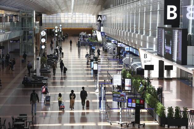 New coronavirus Fewer people than usual are seen at the international departure lobby at Tokyo s Haneda airport on April 25, 2020, the first day of Japan s Golden Week holidays, under a state of emergency over the coronavirus pandemic. 