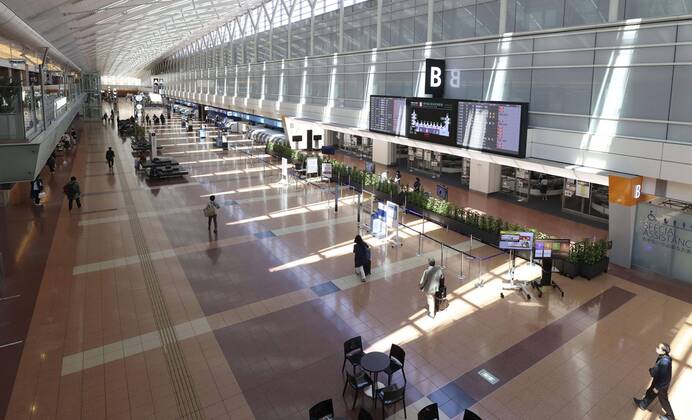 New coronavirus Fewer people than usual are seen at the international departure lobby at Tokyo s Haneda airport on April 25, 2020, the first day of Japan s Golden Week holidays, under a state of emergency over the coronavirus pandemic. 