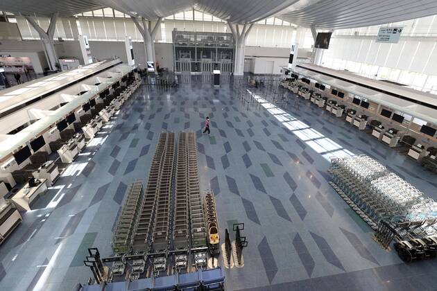 New coronavirus Fewer people than usual are seen at the international departure lobby at Tokyo s Haneda airport on April 25, 2020, the first day of Japan s Golden Week holidays, under a state of emergency over the coronavirus pandemic. 