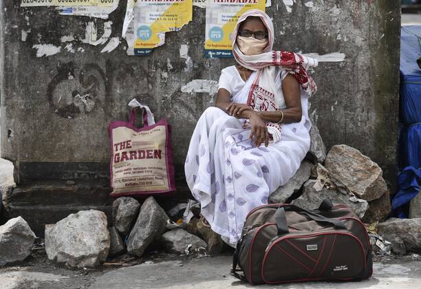 April 25, 2020, Guwahati, Assam, India: A woman arrived at Adabari bus stop to catch a bus, state authorities eased restrictions on inter-district travel for three days, during the nationwide lockdown to curb the spread of coronavirus, in Guwahati. Guwahati India - ZUMAt232 20200425_zip_t232_023 Copyright: xDavidxTalukdarx