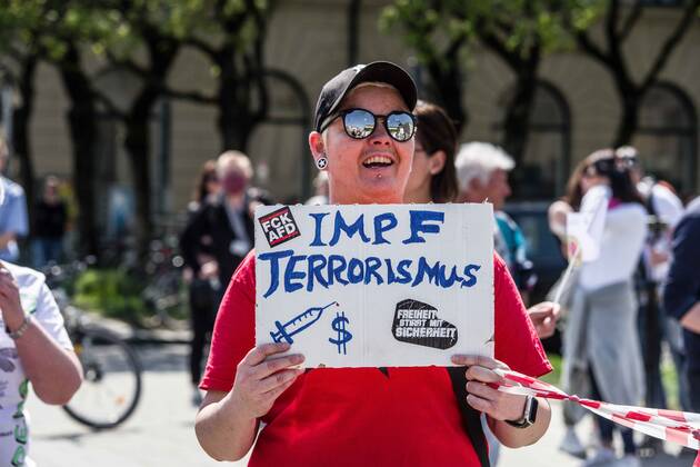 April 25, 2020, Munich, Bavaria, Germany: Vaccine terrorism displayed at a QAnon-like demo in Munich, Germany. Organized in Telegram chats by conspiratorial â€oeQuerfront†(cross-front) groups, the city of Munich, Germany saw numerous QAnon-like, â€oeCorona Parties†as under mottos such as â€oeDemonstration fuer die Erhaltung der Grundrechte†(Demonstration for the Upholding of Basic Rights) and â€oeFuer unsere Freiheit, unsere Grundrechte und unsere Selbstbestimmung†(Demonstration for our Freedom, Basic Rights, and Self-Determination). Numerous right-extremists, Verfassungsschutz-monitored figures, QAnon fans, and AfD politicians were in attendance. The groups are of the belief that the anti-Coronavirus measures are power-grabs. Querfront groups are often a mix of political outliers, AfD mem - ZUMAb160 20200425_zbp_b160_007 Copyright: xSachellexBabbarx