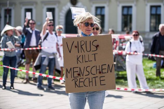 April 25, 2020, Munich, Bavaria, Germany: Organized in Telegram chats by conspiratorial â€oeQuerfront†(cross-front) groups, the city of Munich, Germany saw numerous QAnon-like, â€oeCorona Parties†as under mottos such as â€oeDemonstration fuer die Erhaltung der Grundrechte†(Demonstration for the Upholding of Basic Rights) and â€oeFuer unsere Freiheit, unsere Grundrechte und unsere Selbstbestimmung†(Demonstration for our Freedom, Basic Rights, and Self-Determination). Numerous right-extremists, Verfassungsschutz-monitored figures, QAnon fans, and AfD politicians were in attendance. The groups are of the belief that the anti-Coronavirus measures are power-grabs. Querfront groups are often a mix of political outliers, AfD members, right-extremists and neonazis, conspiracy theorists, Reichsbuerger ( - ZUMAb160 20200425_zbp_b160_020 Copyright: xSachellexBabbarx