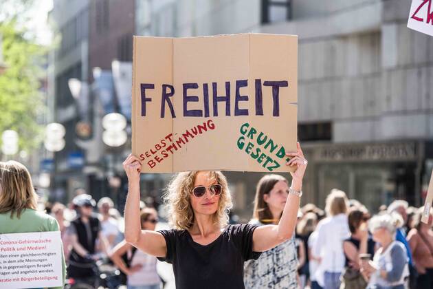 April 25, 2020, Munich, Bavaria, Germany: Freedom..Self-determinations, basic rights held during a QAnon-like demo in Munich, Germany. Organized in Telegram chats by conspiratorial â€oeQuerfront†(cross-front) groups, the city of Munich, Germany saw numerous anti-state â€oeCorona Parties†as under mottos such as â€oeDemonstration fuer die Erhaltung der Grundrechte†(Demonstration for the Upholding of Basic Rights) and â€oeFuer unsere Freiheit, unsere Grundrechte und unsere Selbstbestimmung†(Demonstration for our Freedom, Basic Rights, and Self-Determination). Numerous right-extremists, Verfassungsschutz-monitored figures, QAnon fans, and AfD politicians were in attendance. The groups are of the belief that the anti-Coronavirus measures are power-grabs. Querfront groups are often a mix of polit - ZUMAb160 20200425_zbp_b160_029 Copyright: xSachellexBabbarx