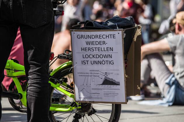 April 25, 2020, Munich, Bavaria, Germany: Reinstate basic rights, the lockdown is unnecessary displayed at a QAnon-like demo in Munich, Germany. Organized in Telegram chats by conspiratorial â€oeQuerfront†(cross-front) groups, the city of Munich, Germany saw numerous anti-state â€oeCorona Parties†as under mottos such as â€oeDemonstration fuer die Erhaltung der Grundrechte†(Demonstration for the Upholding of Basic Rights) and â€oeFuer unsere Freiheit, unsere Grundrechte und unsere Selbstbestimmung†(Demonstration for our Freedom, Basic Rights, and Self-Determination). Numerous right-extremists, Verfassungsschutz-monitored figures, QAnon fans, and AfD politicians were in attendance. The groups are of the belief that the anti-Coronavirus measures are power-grabs. Querfront groups are often a mi - ZUMAb160 20200425_zbp_b160_036 Copyright: xSachellexBabbarx