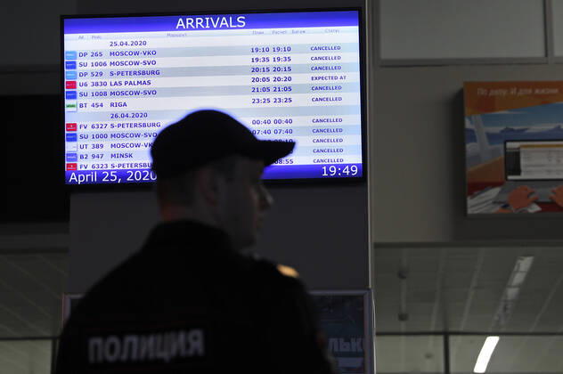 KALININGRAD REGION, RUSSIA - APRIL 25, 2020: A police officer at Kaliningrad s Khrabrovo International Airport ahead of the arrival of the Russian sailors evacuated by an Ural Airlines charter flight from the Spanish port of Las Palmas. On March 27, the Russian government ordered an international flight ban amid the ongoing COVID-19 pandemic, so around 400 Russian sailors, including those 200 from Kaliningrad, found themselves stranded at Gran Canaria Airport. Vitaly Nevar TASS  TS0D713A