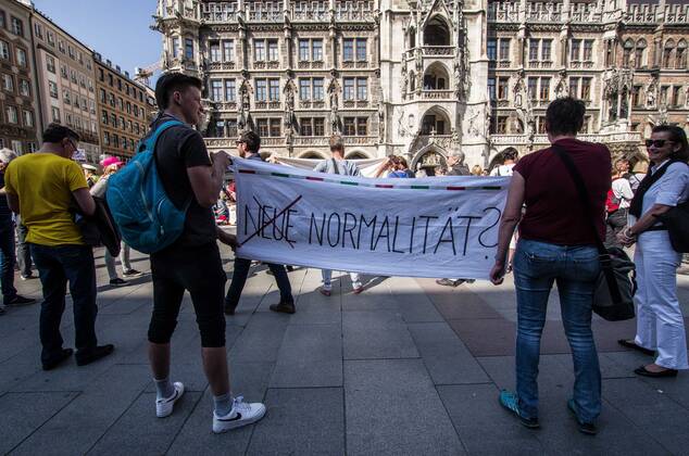 April 25, 2020, Munich, Bavaria, Germany: The New Normal? displayed during a QAnon-like demo in Munich, Germany. Organized in Telegram chats by conspiratorial â€oeQuerfront†(cross-front) groups, the city of Munich, Germany saw numerous anti-state â€oeCorona Parties†as under mottos such as â€oeDemonstration fuer die Erhaltung der Grundrechte†(Demonstration for the Upholding of Basic Rights) and â€oeFuer unsere Freiheit, unsere Grundrechte und unsere Selbstbestimmung†(Demonstration for our Freedom, Basic Rights, and Self-Determination). Numerous right-extremists, Verfassungsschutz-monitored figures, QAnon fans, and AfD politicians were in attendance. The groups are of the belief that the anti-Coronavirus measures are power-grabs. Querfront groups are often a mix of political outliers, AfD me - ZUMAb160 20200425_zbp_b160_065 Copyright: xSachellexBabbarx