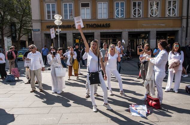 April 25, 2020, Munich, Bavaria, Germany: Sina Bodden leading her bloc at a QAnon-like demo at Marienplatz, Munich, Germany. Organized in Telegram chats by conspiratorial â€oeQuerfront†(cross-front) groups, the city of Munich, Germany saw numerous anti-state â€oeCorona Parties†as under mottos such as â€oeDemonstration fuer die Erhaltung der Grundrechte†(Demonstration for the Upholding of Basic Rights) and â€oeFuer unsere Freiheit, unsere Grundrechte und unsere Selbstbestimmung†(Demonstration for our Freedom, Basic Rights, and Self-Determination). Numerous right-extremists, Verfassungsschutz-monitored figures, QAnon fans, and AfD politicians were in attendance. The groups are of the belief that the anti-Coronavirus measures are power-grabs. Querfront groups are often a mix of political outliers, - ZUMAb160 20200425_zbp_b160_067 Copyright: xSachellexBabbarx