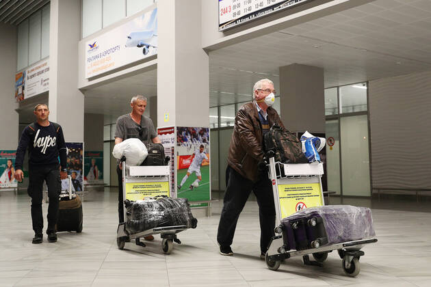 KALININGRAD REGION, RUSSIA - APRIL 25, 2020: Russian sailors evacuated by an Ural Airlines charter flight from the Spanish port of Las Palmas arrive at Kaliningrad s Khrabrovo International Airport. On March 27, the Russian government ordered an international flight ban amid the ongoing COVID-19 pandemic, so around 400 Russian sailors, including those 200 from Kaliningrad, found themselves stranded at Gran Canaria Airport. Vitaly Nevar TASS  TS0D713C