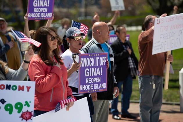 Protesters cheer at a Rhode Islanders against excessive quarantine protest in reaction to the state s mandatory stay-at-home order as an attempt to combat COVID-19 at the Rhode Island State House in Providence, Rhode Island on Saturday, April 25, 2020. Rhode Island Governor Gina Raimondo has extended the stay-at-home order in an effort to combat the spread of COVID-19 to May 8th and recently told schools that they will finish the year through via distance learning. Rhode Island has had 6,699 confirmed cases of COVID-19 and 202 deaths as of Saturday.  PVD20200425101 MATTHEWxHEALEY