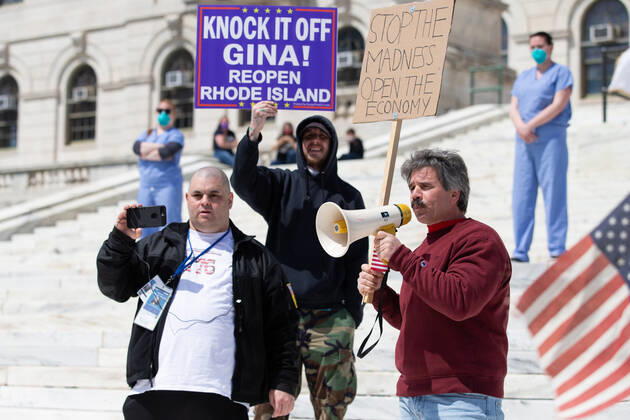 A speaker addresses the small crowd gathered for a Rhode Islanders against excessive quarantine protest in reaction to the state s mandatory stay-at-home order as an attempt to combat COVID-19 at the Rhode Island State House in Providence, Rhode Island on Saturday, April 25, 2020. Rhode Island Governor Gina Raimondo has extended the stay-at-home order in an effort to combat the spread of COVID-19 to May 8th and recently told schools that they will finish the year through via distance learning. Rhode Island has had 6,699 confirmed cases of COVID-19 and 202 deaths as of Saturday.  PVD20200425106 MATTHEWxHEALEY