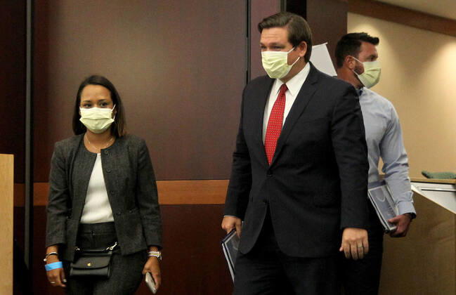 April 25, 2020, Weston, FL, USA: Florida Gov. Ron De Santis, right, arrives at a news conference regarding COVID-19 at the Florida Cleveland Clinic in Weston, Fla., on Saturday, April 25, 2020. Weston USA - ZUMAm67_ 20200425_zaf_m67_001 Copyright: xPedroxPortalx
