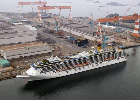 New coronavirus Photo taken from a Kyodo News helicopter on April 26, 2020, shows the Costa Atlantica cruise ship anchored in the southwestern Japan city of Nagasaki on April 26, 2020. Out of 623 crew members with no passengers on board, 148 have tested positive for the new coronavirus. 