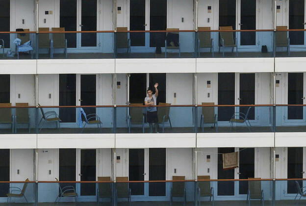New coronavirus Photo taken from a Kyodo News helicopter on April 26, 2020, shows the Costa Atlantica cruise ship anchored in the southwestern Japan city of Nagasaki on April 26, 2020. Out of 623 crew members with no passengers on board, 148 have tested positive for the new coronavirus. 