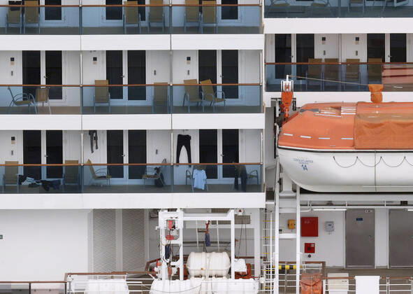 New coronavirus Photo taken from a Kyodo News helicopter on April 26, 2020, shows the Costa Atlantica cruise ship anchored in the southwestern Japan city of Nagasaki on April 26, 2020. Out of 623 crew members with no passengers on board, 148 have tested positive for the new coronavirus. 