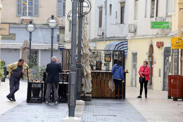 Rainy Sunday in Rijeka 26.04.2020., Croatia, Rijeka - Morning rain after a long time in Rijeka area and few citizens in the city center, except in places where coffee is sold outside and at the city market. GoranxKovacic PIXSELL
