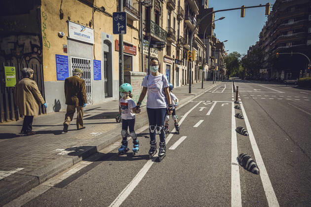April 26, 2020: A small boy wearing a protective face mask rides his bike as Spain eases the curfew rules for under 14 years old granting them an one hour accompanied walk through the near neighborhood after six weeks of a nationwide lockdown due to the continuous spread of the corona virus. Spain registered nearly 400 new fatalities totaling a death toll close to 23000 so far.Two small children wearing a protective face mask ride their scooter as Spain eases the curfew rules for under 14 years old granting them an one hour accompanied walk through the near neighborhood after six weeks of a nationwide lockdown due to the continuous spread of the corona virus. Spain registered nearly 400 new fatalities totaling a death toll close to 23000 so far. - ZUMAo105 20200426_zap_o105_001 Copyright: xMatthiasxOesterlex