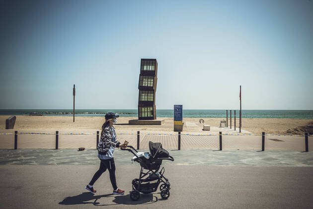 April 26, 2020: A mom with her baby passes the Wounded Star sculpture by Rebecca Horn at Barceloneta s beach as Spain eases the curfew rules for under 14 years old granting them an one hour accompanied walk through the near neighborhood after six weeks of a nationwide lockdown due to the continuous spread of the corona virus. Spain registered nearly 400 new fatalities totaling a death toll close to 23000 so far. - ZUMAo105 20200426_zap_o105_015 Copyright: xMatthiasxOesterlex