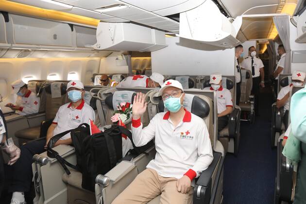 (200426) -- BAGHDAD, April 26, 2020 (Xinhua) -- Chinese medical experts board a plane at the Baghdad International Airport in Baghdad, Iraq, April 26, 2020. A Chinese team of medical experts had left Baghdad on Sunday, heading to China after 50 days of hard work of supporting the Iraqi health system to contain the COVID-19 epidemic. (Xinhua) IRAQ-BAGHDAD-COVID-19-CHINESE EXPERTS 