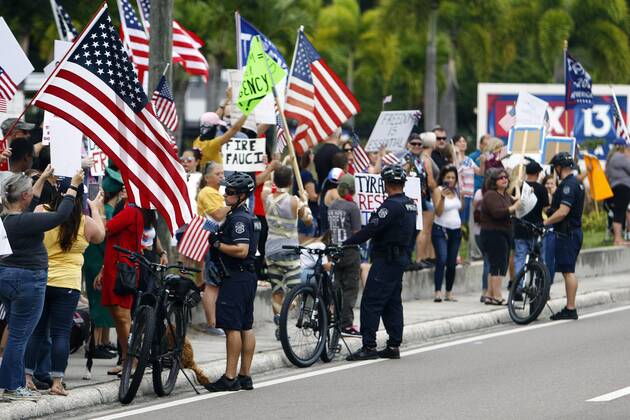 April 26, 2020, Tampa, Florida, USA: Over 100 supporters of the Re-Open Florida CARavan and Rally movement gathered to protest in front of the FOX 13 News Station on Kennedy on Sunday, April 26, 2020 in Tampa. The group held signs, played music and spread their message to reopen the state of Florida after being closed for months. Tampa USA - ZUMAs70_ 20200426_zan_s70_004 Copyright: xLuisxSantanax