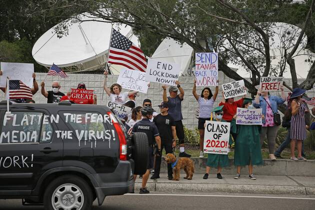 April 26, 2020, Tampa, Florida, USA: Over 100 supporters of the Re-Open Florida CARavan and Rally movement gathered to protest in front of the FOX 13 News Station on Kennedy on Sunday, April 26, 2020 in Tampa. The group held signs, played music and spread their message to reopen the state of Florida after being closed for months. Tampa USA - ZUMAs70_ 20200426_zan_s70_011 Copyright: xLuisxSantanax