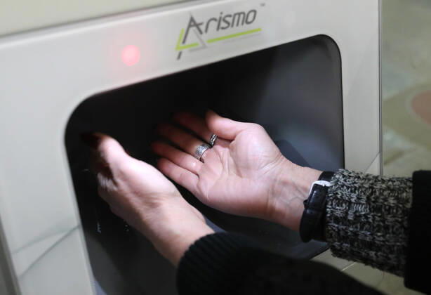 MOSCOW, RUSSIA - APRIL 27, 2020: A commuter uses a contactless hand sanitiser machine at the entrance to a station of the Moscow Underground (metro), during the pandemic of the novel coronavirus disease (COVID-19). Since 30 March, Moscow has been on lockdown. On 13 April 2020, the Moscow government introduced a digital permit system aimed at further restricting movement. Under the scheme, which became mandatory on 15 April, people need to apply for permits to travel on a vehicle or public transport around the city. As of 27 April 2020, Russia has reported more than 87,300 confirmed cases of the novel coronavirus infection, with more than 45,300 confirmed cases in Moscow. Vladimir Gerdo TASS  TS0D7341