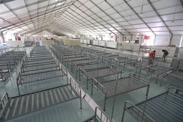 April 27, 2020, Dhaka, Bangladesh: Bangladeshi workers prepare a makeshift hospital for the treatment of Covid-19 patients at the Bashundhara Convention Centre during the nationwide lockdown to curb the spread of coronavirus (COVID-19) in Dhaka, Bangladesh, April 27, 2020. The largest makeshift hospital in the country for treating coronavirus infected patients at the International Convention City Bashundhara (ICCB) in the capital is getting ready to be inaugurated shortly. The hospital works are almost completed to be opened anytime by the government authorities concerned. Dhaka Bangladesh - ZUMAd117 20200427_zap_d117_004 Copyright: xSuvraxKantixDasx