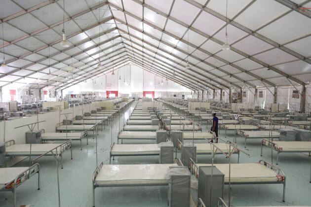 April 27, 2020, Dhaka, Bangladesh: Bangladeshi workers prepare a makeshift hospital for the treatment of Covid-19 patients at the Bashundhara Convention Centre during the nationwide lockdown to curb the spread of coronavirus (COVID-19) in Dhaka, Bangladesh, April 27, 2020. The largest makeshift hospital in the country for treating coronavirus infected patients at the International Convention City Bashundhara (ICCB) in the capital is getting ready to be inaugurated shortly. The hospital works are almost completed to be opened anytime by the government authorities concerned. Dhaka Bangladesh - ZUMAd117 20200427_zap_d117_010 Copyright: xSuvraxKantixDasx