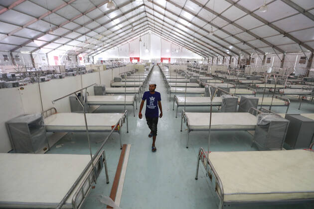 April 27, 2020, Dhaka, Bangladesh: Bangladeshi workers prepare a makeshift hospital for the treatment of Covid-19 patients at the Bashundhara Convention Centre during the nationwide lockdown to curb the spread of coronavirus (COVID-19) in Dhaka, Bangladesh, April 27, 2020. The largest makeshift hospital in the country for treating coronavirus infected patients at the International Convention City Bashundhara (ICCB) in the capital is getting ready to be inaugurated shortly. The hospital works are almost completed to be opened anytime by the government authorities concerned. Dhaka Bangladesh - ZUMAd117 20200427_zap_d117_012 Copyright: xSuvraxKantixDasx