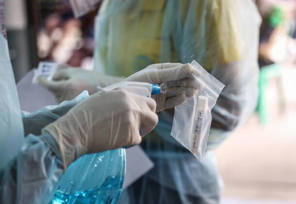 April 27, 2020, Bangkok, Thailand: A health worker wearing gloves as a precaution is seen injecting alcohol which cleans the secretions of patients suspected to be infected with the covid-19 Coronavirus during lab examination..Coronavirus disease (COVID-19) is an infectious disease caused by a newly discovered coronavirus. the virus that causes COVID-19 is mainly transmitted through droplets generated when an infected person coughs, sneezes, or exhales, these droplets are too heavy to hang in the air, and quickly fall on floors or surfaces. Bangkok Thailand - ZUMAs197 20200427_zaa_s197_014 Copyright: xPrawetxPuengsawangpholx