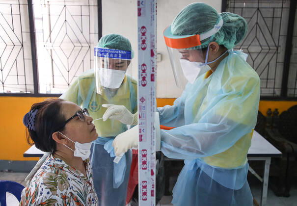 April 27, 2020, Bangkok, Thailand: Medical health workers at Mongkutwattana General Hospital wear protective gears as a precaution while screening a patient suspected to be infected with the covid-19 Coronavirus during lab examination..Coronavirus disease (COVID-19) is an infectious disease caused by a newly discovered coronavirus. the virus that causes COVID-19 is mainly transmitted through droplets generated when an infected person coughs, sneezes, or exhales, these droplets are too heavy to hang in the air, and quickly fall on floors or surfaces. Bangkok Thailand - ZUMAs197 20200427_zaa_s197_029 Copyright: xPrawetxPuengsawangpholx