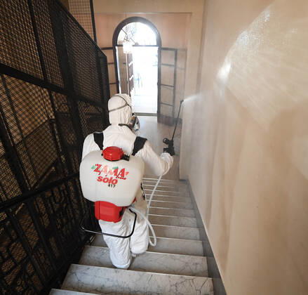 (200427) -- ROME, April 27, 2020 (Xinhua) -- A worker of a disinfection company disinfects a residential building amid the coronavirus pandemic in Rome, Italy, April 27, 2020. (Photo by Alberto Lingria Xinhua) ITALY-ROME-COVID-19-DISINFECTION 