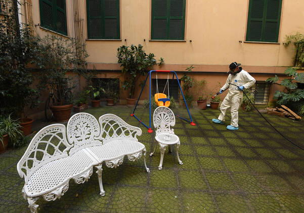 (200427) -- ROME, April 27, 2020 (Xinhua) -- A worker of a disinfection company disinfects the surroundings of a residential building amid the coronavirus pandemic in Rome, Italy, April 27, 2020. (Photo by Alberto Lingria Xinhua) ITALY-ROME-COVID-19-DISINFECTION 